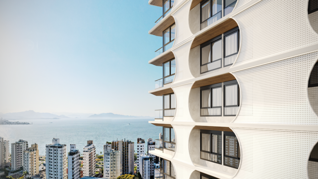 Detalhe da fachada do Edifício Residencial Cais com varandas curvas e vista para o mar